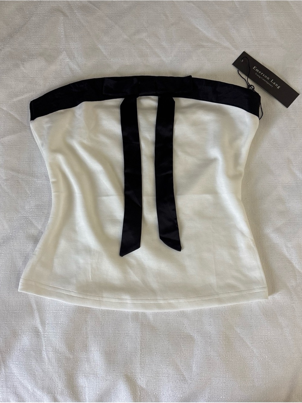 White and black strapless top with bow detail